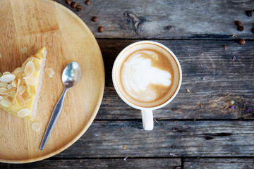 Coffee cup and cake on wooden.