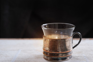 Coffee vintage cup, black background