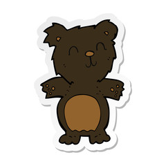 sticker of a cartoon cute black bear cub