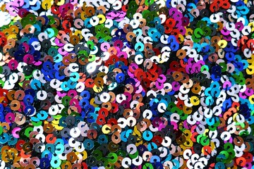 Sequins macro background.Multicolored sequins.Glitter iridescent fabric.Scales background. fabric...
