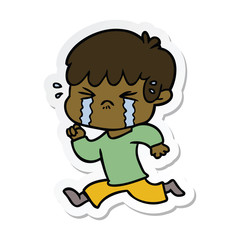 sticker of a cartoon boy crying