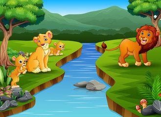 Obraz na płótnie Canvas Happy lion family playing on the nature