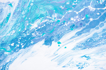 Beautiful background of liquid acrylic in blue, green and white on canvas