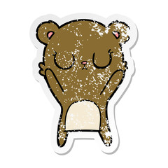 distressed sticker of a peaceful cartoon bear cub