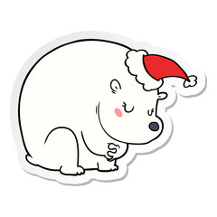 cute sticker cartoon of a polar bear wearing santa hat
