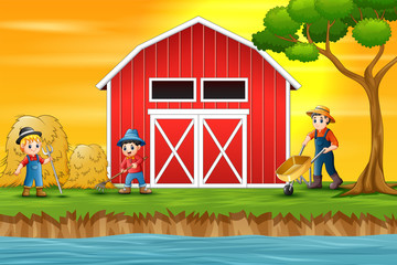 Obraz na płótnie Canvas Farmers working in front of a barn