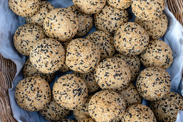 Coconut rice balls with sesame seeds is traditional Thai dessert made from rice flour and coconut milk at street food market in Thailand
