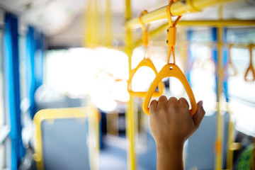 inside the bus yellow hand grip for the passenger to hold