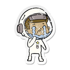 distressed sticker of a cartoon crying astronaut
