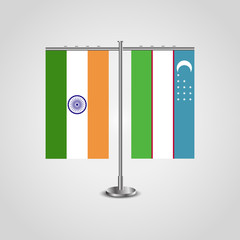 Table stand with flags of India and Uzbekistan.Two flag. Flag pole. Symbolizing the cooperation between the two countries. Table flags