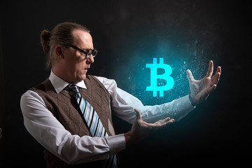 Funny nerd or geek showing bitcoin icon