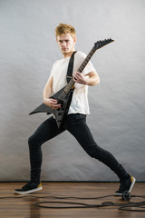 Fototapeta premium Man playing on electric guitar