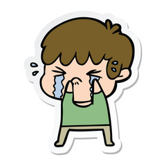 sticker of a cartoon boy crying