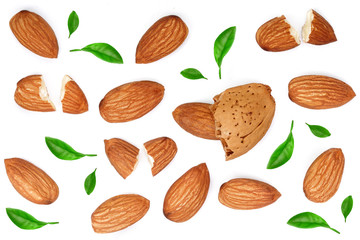 almonds with leaves isolated on white background. Top view. Flat lay pattern