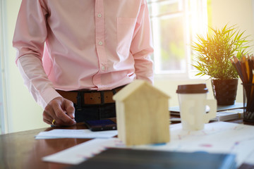 businessmen are preparing financial documents for investment in an apartment.concept