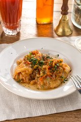 cabbage rolls stuffed with ground beef and rice on wooden table