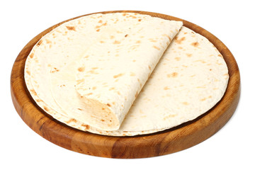 Tortilla wrap on wooden board isolated on white background
