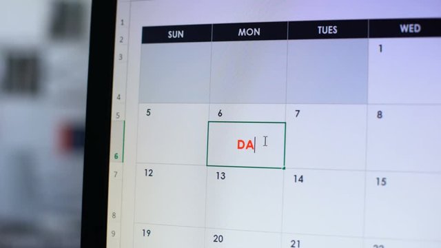 Date scheduled in online calendar hand pointing at pc screen, important reminder