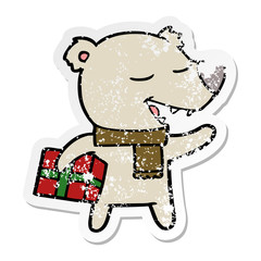 distressed sticker of a cartoon bear with present
