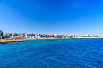 Naklejka na ściany i meble Panoramic view on Hurghada city from the Red sea