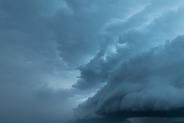 Texture of storm clouds on dark sky.