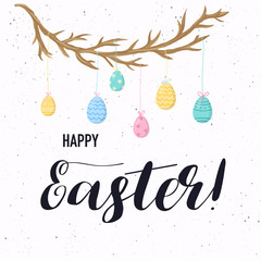 Happy Easter greeting card. Easter eggs composition with wooden branch.