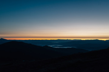 Sunset in the mountains. Beautiful sunset from a bird's flight.