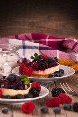 Cheesecakes with mixed berries. 