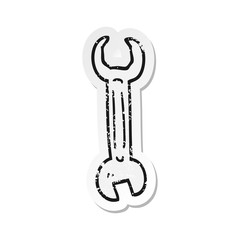 retro distressed sticker of a cartoon spanner