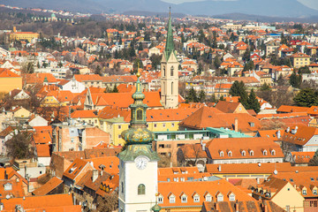 Naklejka premium Zagreb center, aerial view, rooftops and church towers, Medvednica mountain in background