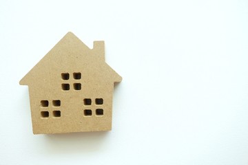 A mini wooden house on white background. 