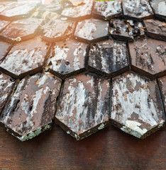 Old wooden roof texture background / Shingle roof in poor repair
