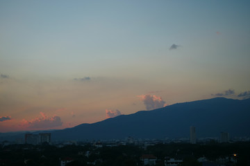 beautiful dramatic sunset sky above the city skyline