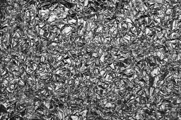 Wrinkled foil texture, silver metallic background