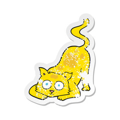 retro distressed sticker of a cartoon cat
