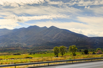 View of the road bend and a mountain range in Spain
