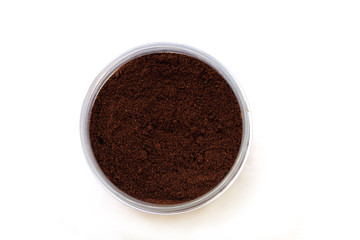 Grains of coffee in a jar, top view
