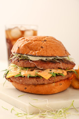 Tasty burger on light table