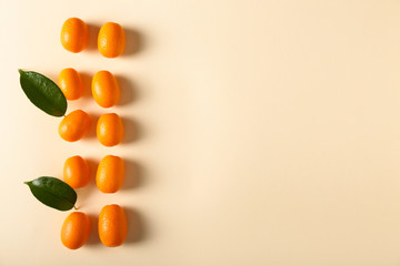 Delicious kumquat fruit on light background