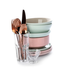 Set of clean tableware on white background