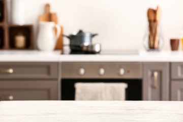 Obraz na płótnie Canvas Wooden table in modern kitchen