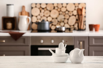 Fototapeta na wymiar Set of tableware in modern kitchen