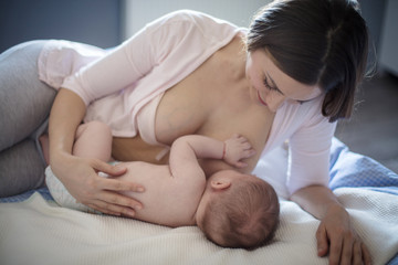 Obraz na płótnie Canvas The baby sleeps easier with her mother's milk.