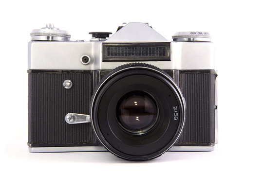 old film mirror full-frame photo camera with lens on white background. isolated.
