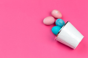 Colorful easter painted eggs on pink background