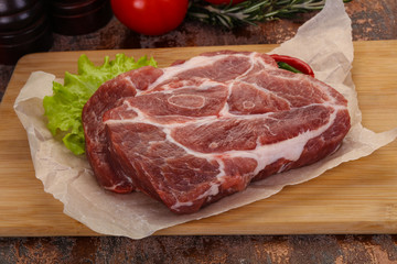 Raw pork neck steak