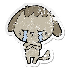 distressed sticker of a cartoon crying dog