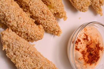 Pile of breaded crab sticks isolated