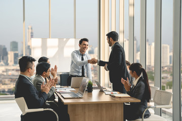 Businesspeople discussing together in conference room during meeting at office.