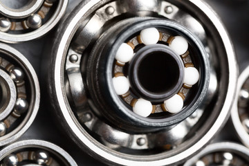 Machinery and technology industrial background. Group of various ball bearings close up.
